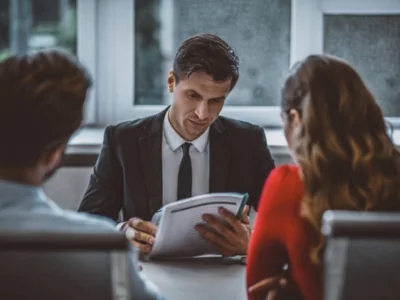 Illustrative meeting to review legal documents at a desk